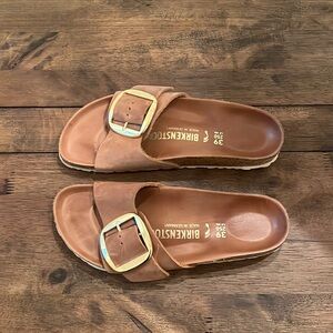 Birkenstock Madrid Big Buckle slides in rich cognac
